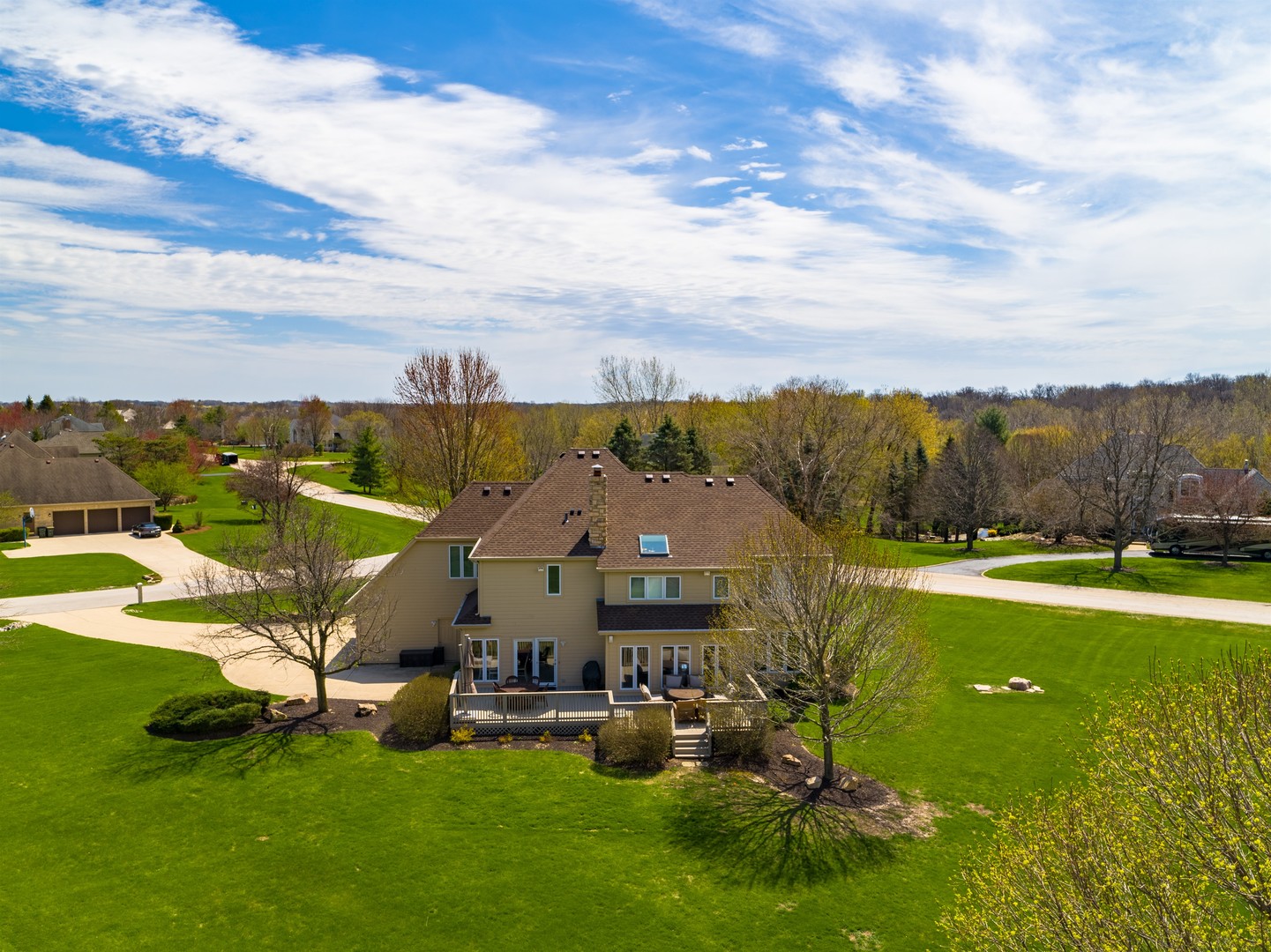 6N734 Henricksen Road St. Charles, IL 60175 - Photo 33 of 40 a view of a big house with a big yard and large trees