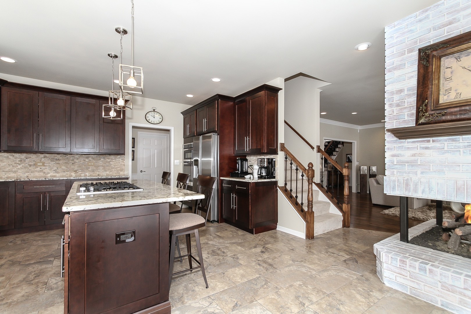 6N734 Henricksen Road St. Charles, IL 60175 - Photo 9 of 40 a kitchen with a stove cabinets and a refrigerator