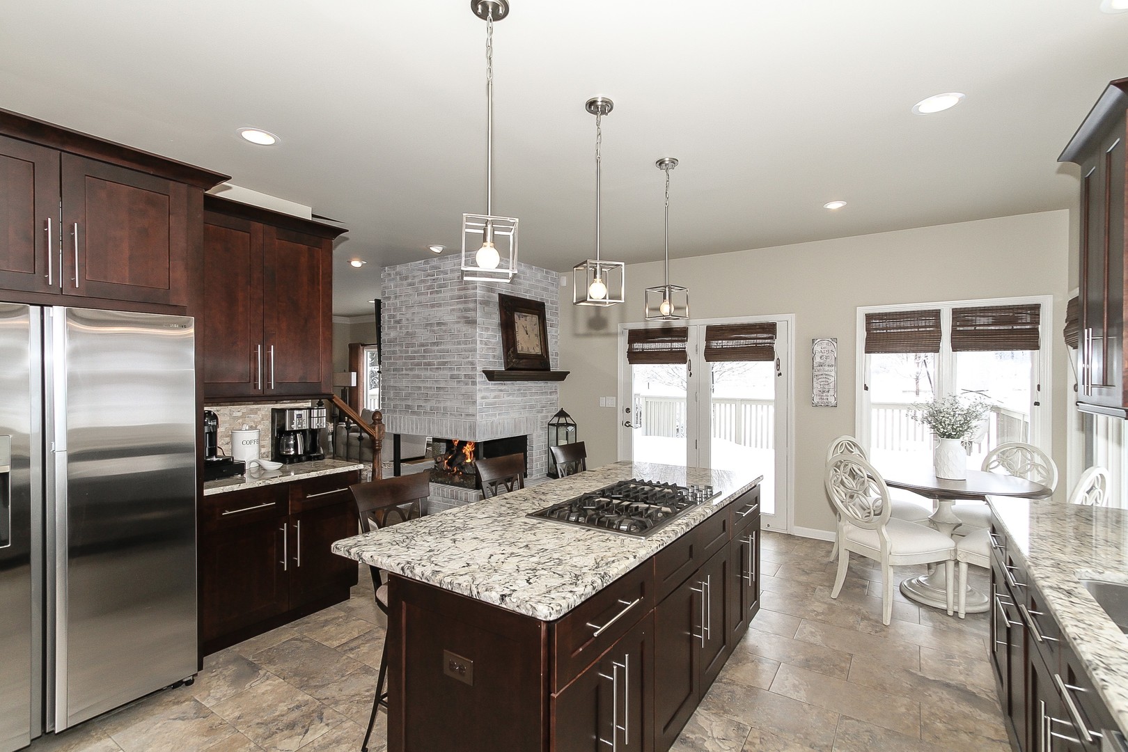 6N734 Henricksen Road St. Charles, IL 60175 - Photo 10 of 40 a kitchen with stainless steel appliances granite countertop a sink a stove and a refrigerator