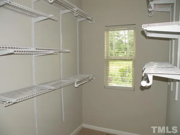 a room with a window and a shower