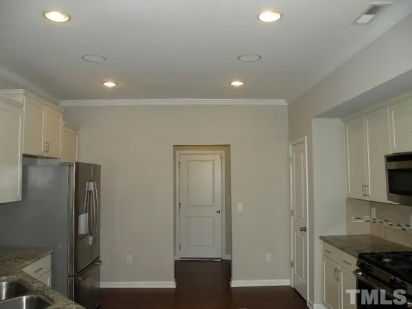 a view of a kitchen from the hallway