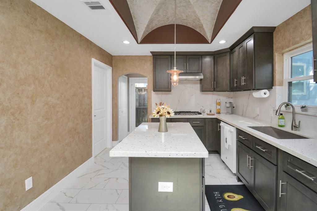 2705 Fox Street Houston, TX 77003 - Photo 11 of 20 a kitchen with a sink stainless steel appliances and cabinets