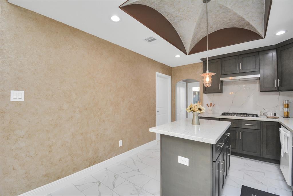 2705 Fox Street Houston, TX 77003 - Photo 13 of 20 a kitchen with stainless steel appliances granite countertop a sink and a stove