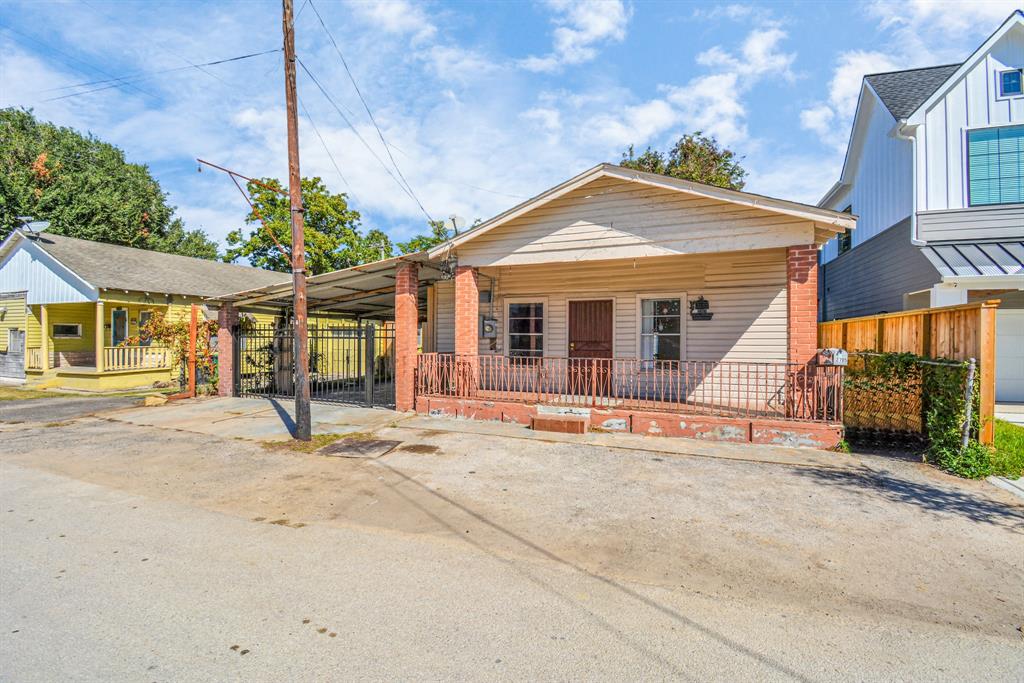 2705 Fox Street Houston, TX 77003 - Photo 2 of 20 a view of a house with a patio and a yard