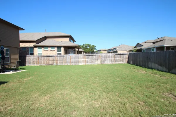a view of a backyard with a garden and plants
