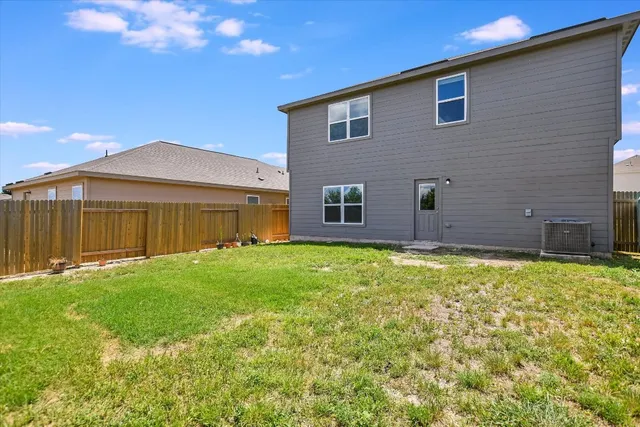 a bedroom with bed and painting on the wall