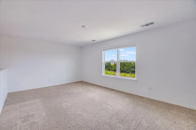 a kitchen with stainless steel appliances kitchen island granite countertop a stove a sink and a refrigerator