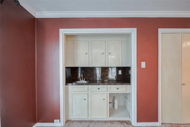 a bathroom with a granite countertop sink a toilet and a mirror