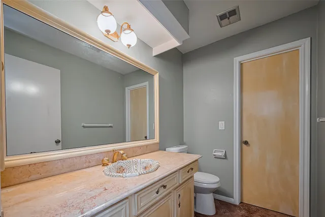 a view of a livingroom with a chandelier fan
