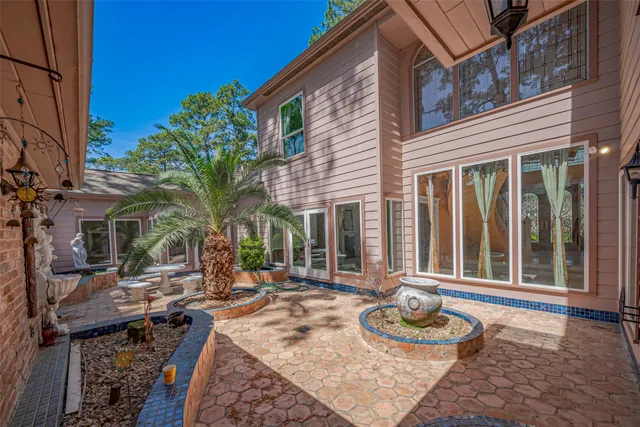 a view of a patio with chairs and table
