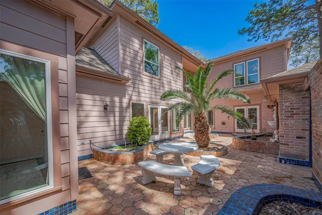 a view of a backyard with wooden fence