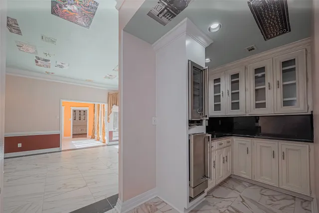 a kitchen with granite countertop a sink and cabinets