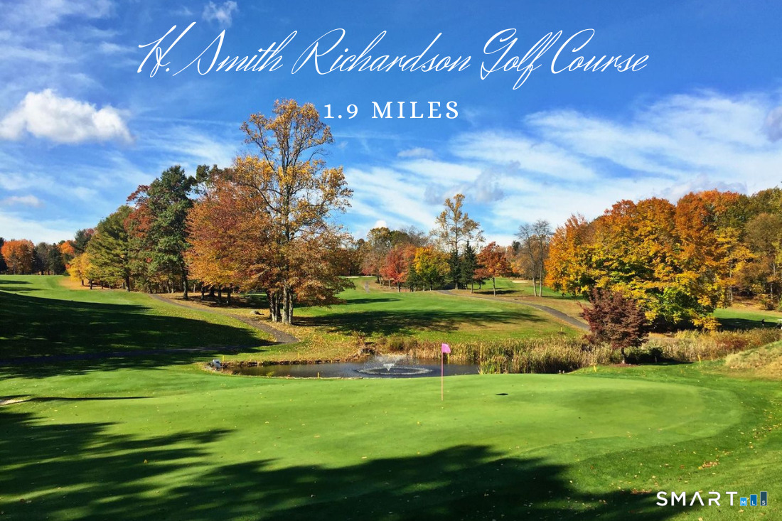 370 Nepas Road Fairfield, CT 06825 - Photo 29 of 32 a view of a golf course with a lake in the background