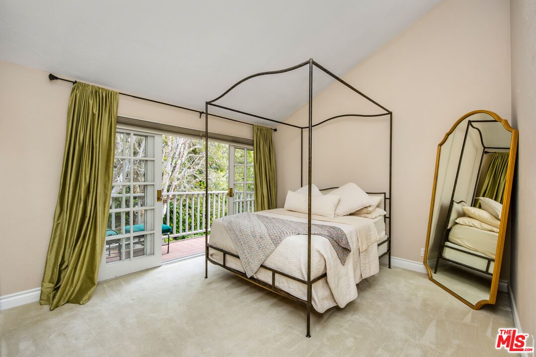 2124 Eric Drive Los Angeles, CA 90049 - Photo 18 of 30 a bedroom with a bed and a walk in closet