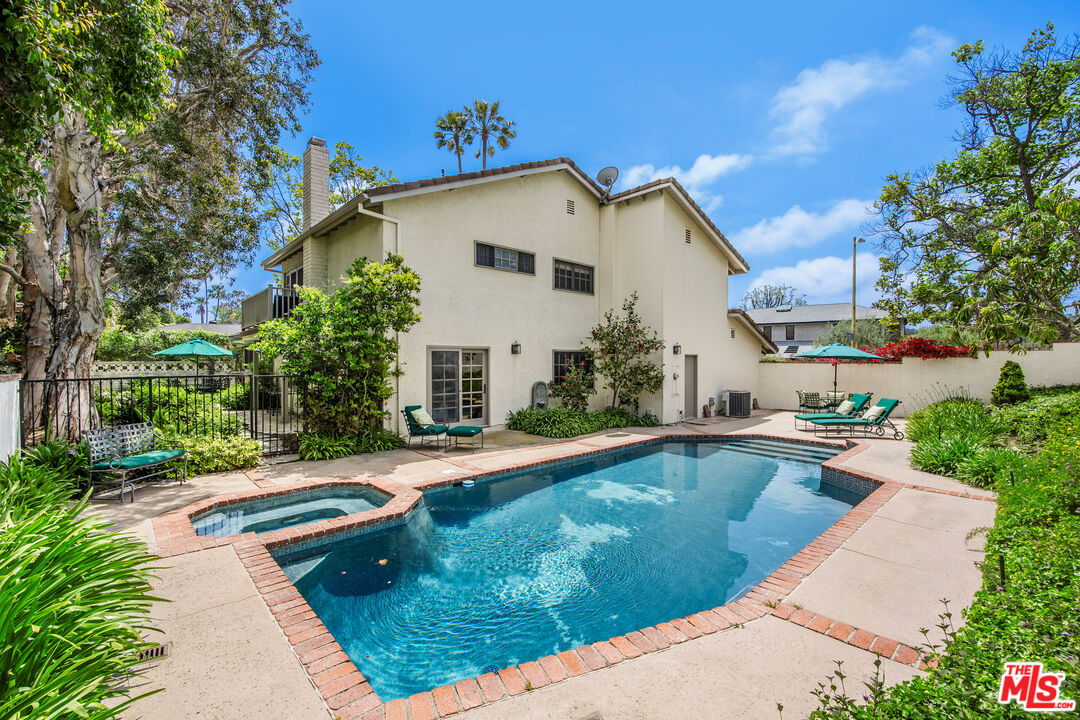 2124 Eric Drive Los Angeles, CA 90049 - Photo 2 of 30 a view of a house with swimming pool and sitting area