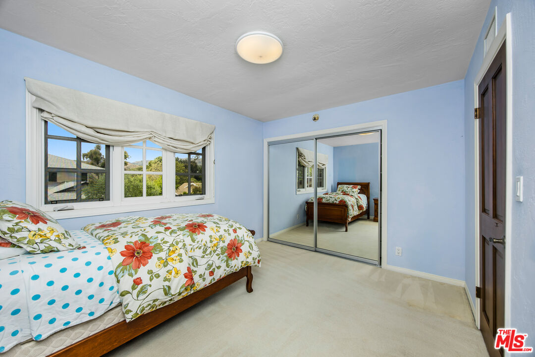 2124 Eric Drive Los Angeles, CA 90049 - Photo 24 of 30 a bedroom with bed and a window