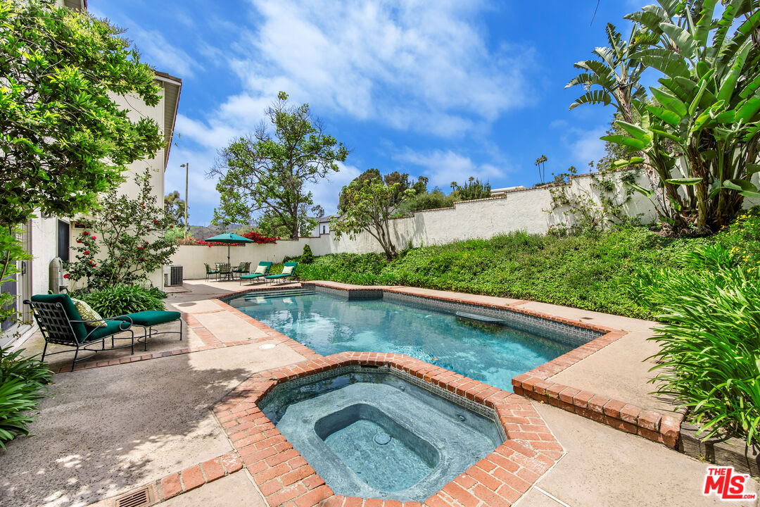 2124 Eric Drive Los Angeles, CA 90049 - Photo 26 of 30 a view of a swimming pool with a patio