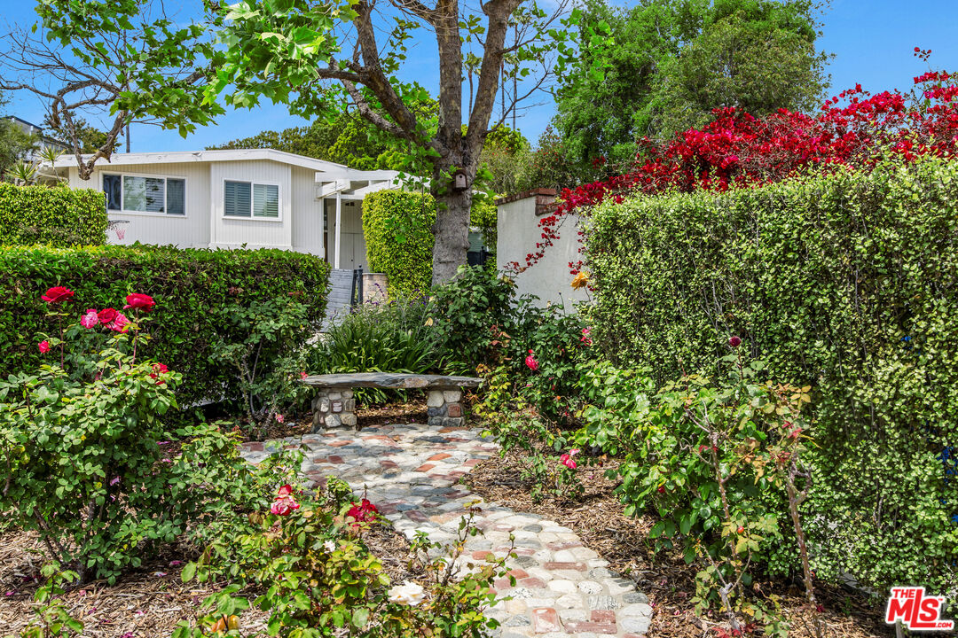 2124 Eric Drive Los Angeles, CA 90049 - Photo 28 of 30 a view of a house with a yard and garden