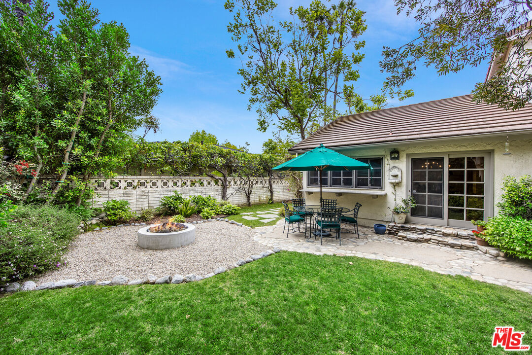 2124 Eric Drive Los Angeles, CA 90049 - Photo 29 of 30 a view of a chair and table in backyard of the house