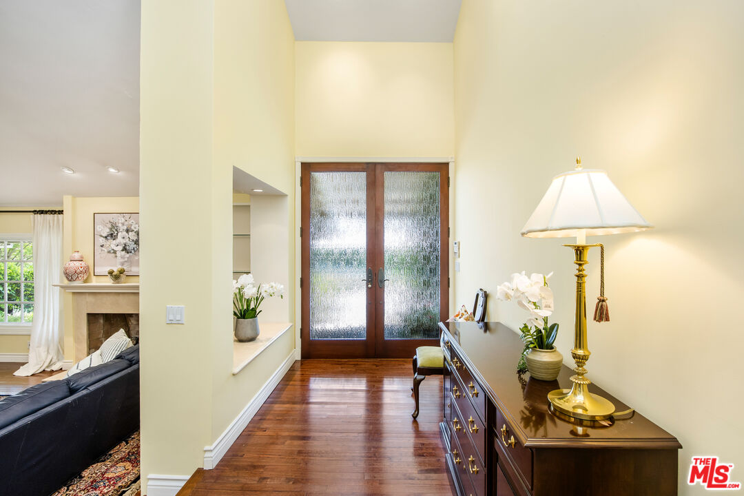 2124 Eric Drive Los Angeles, CA 90049 - Photo 5 of 30 a living room with furniture and a fireplace