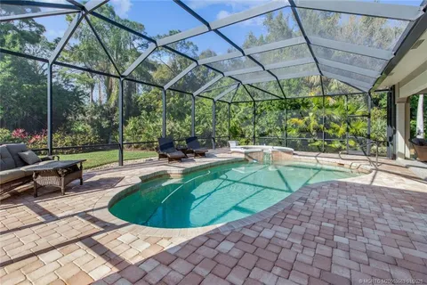 a view of a swimming pool with a patio