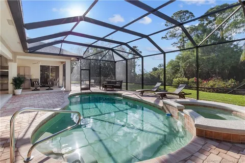a view of a backyard with sitting area
