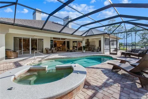 a view of a yard with swimming pool