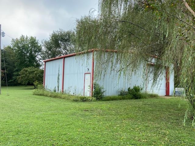 311 Rabbit Trail Road Leoma, TN 38468 - Photo 8 of 23 a backyard of a house with lots of green space