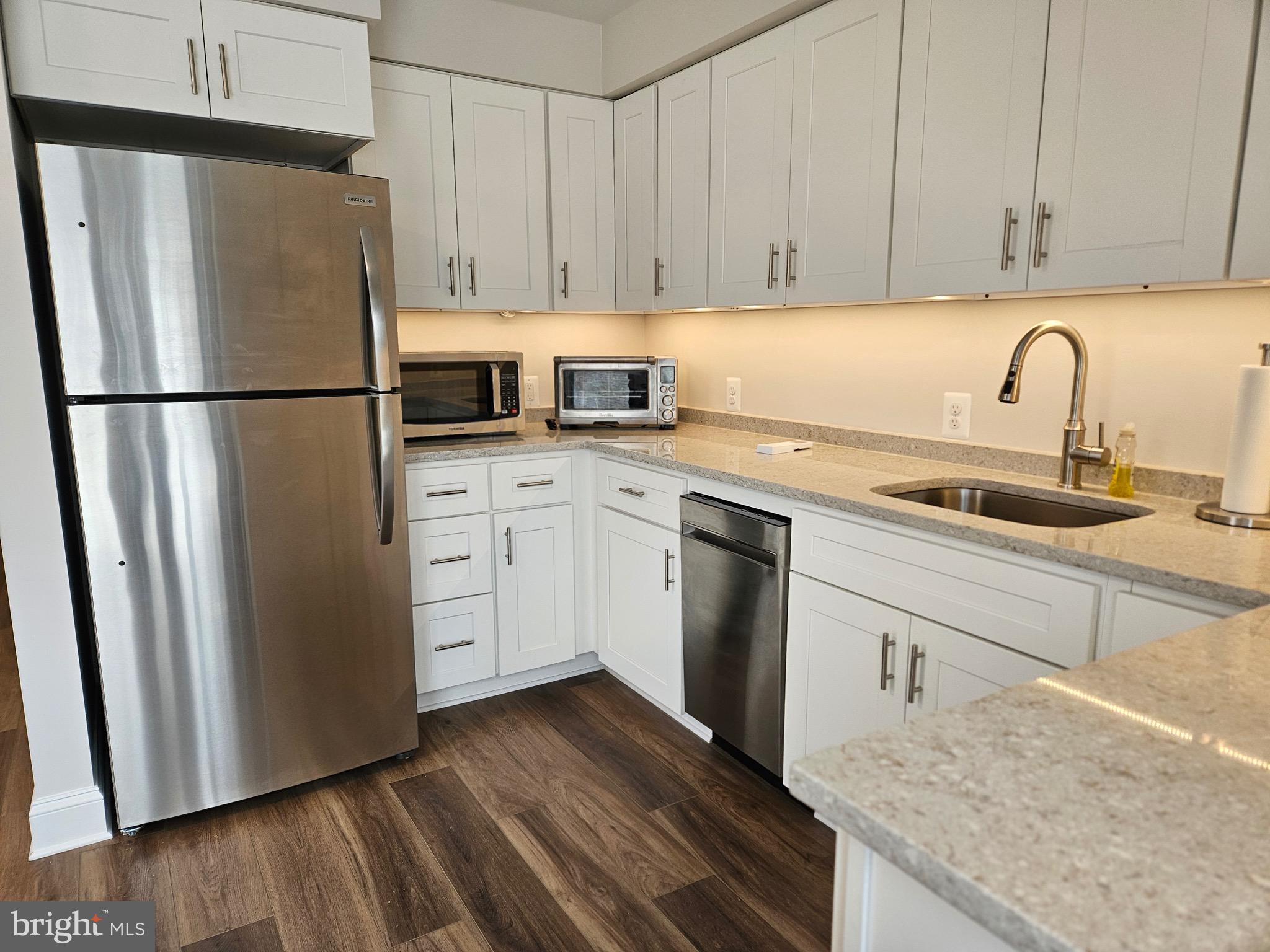 14400 Reva Road Reva, VA 22735 - Photo 4 of 14 a kitchen with a refrigerator sink and cabinets
