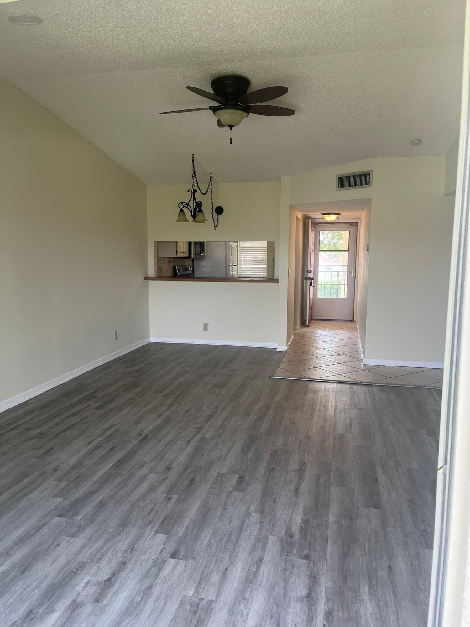 9993 Three Lakes Circle Boca Raton, FL 33428 - Photo 11 of 22 wooden floor in an empty room with a window