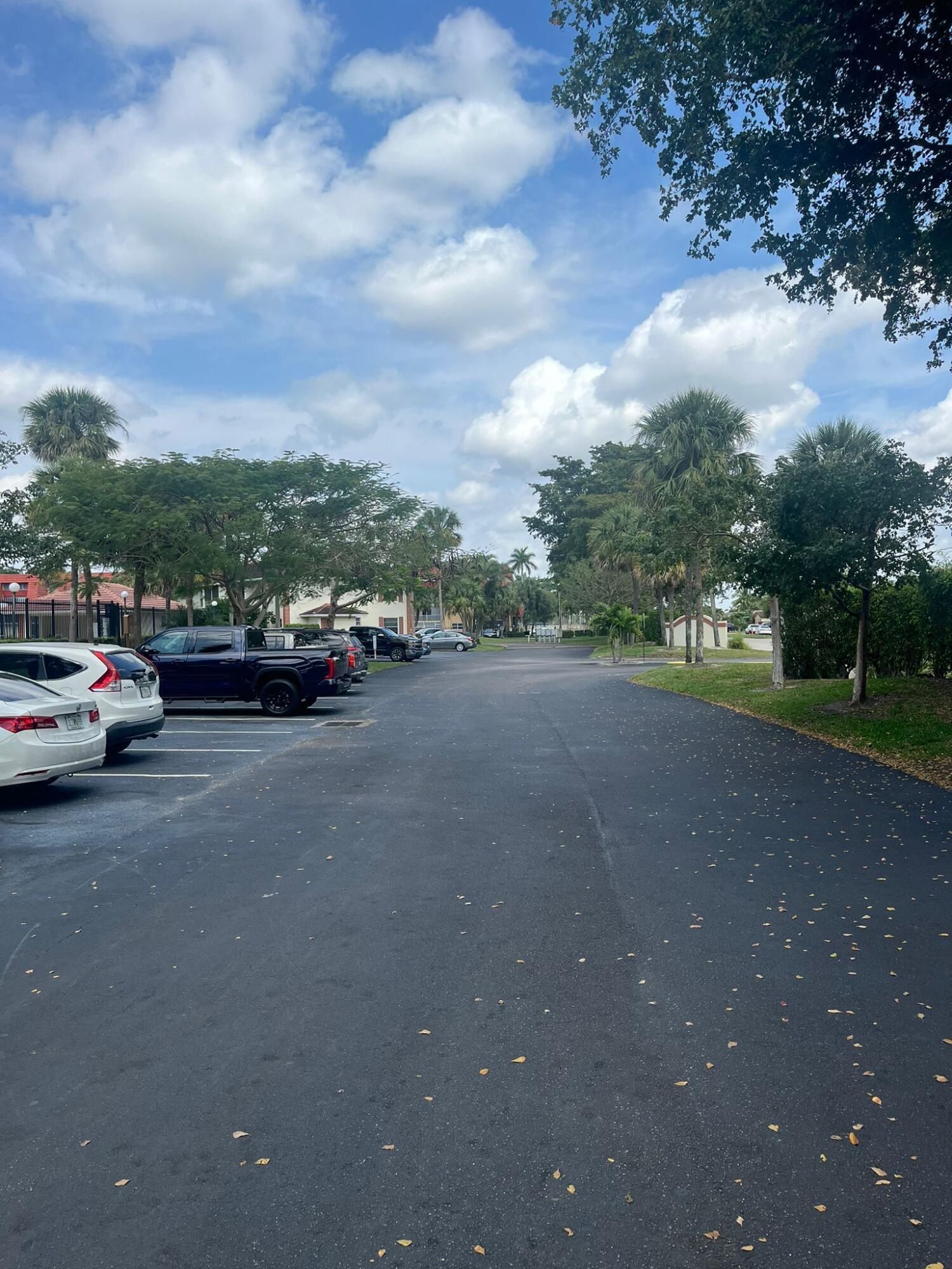 9993 Three Lakes Circle Boca Raton, FL 33428 - Photo 3 of 22 a view of street with parked cars
