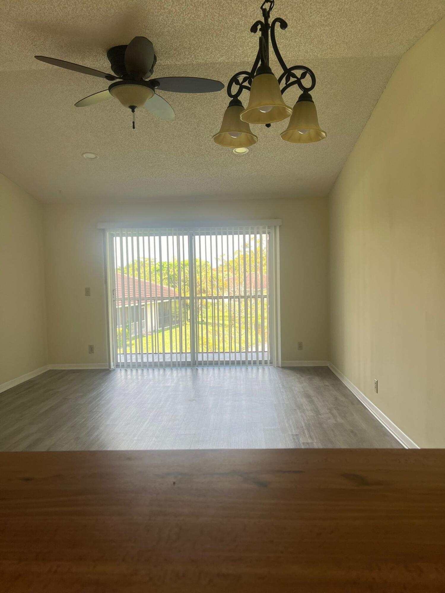 9993 Three Lakes Circle Boca Raton, FL 33428 - Photo 4 of 22 a view of an empty room and a window