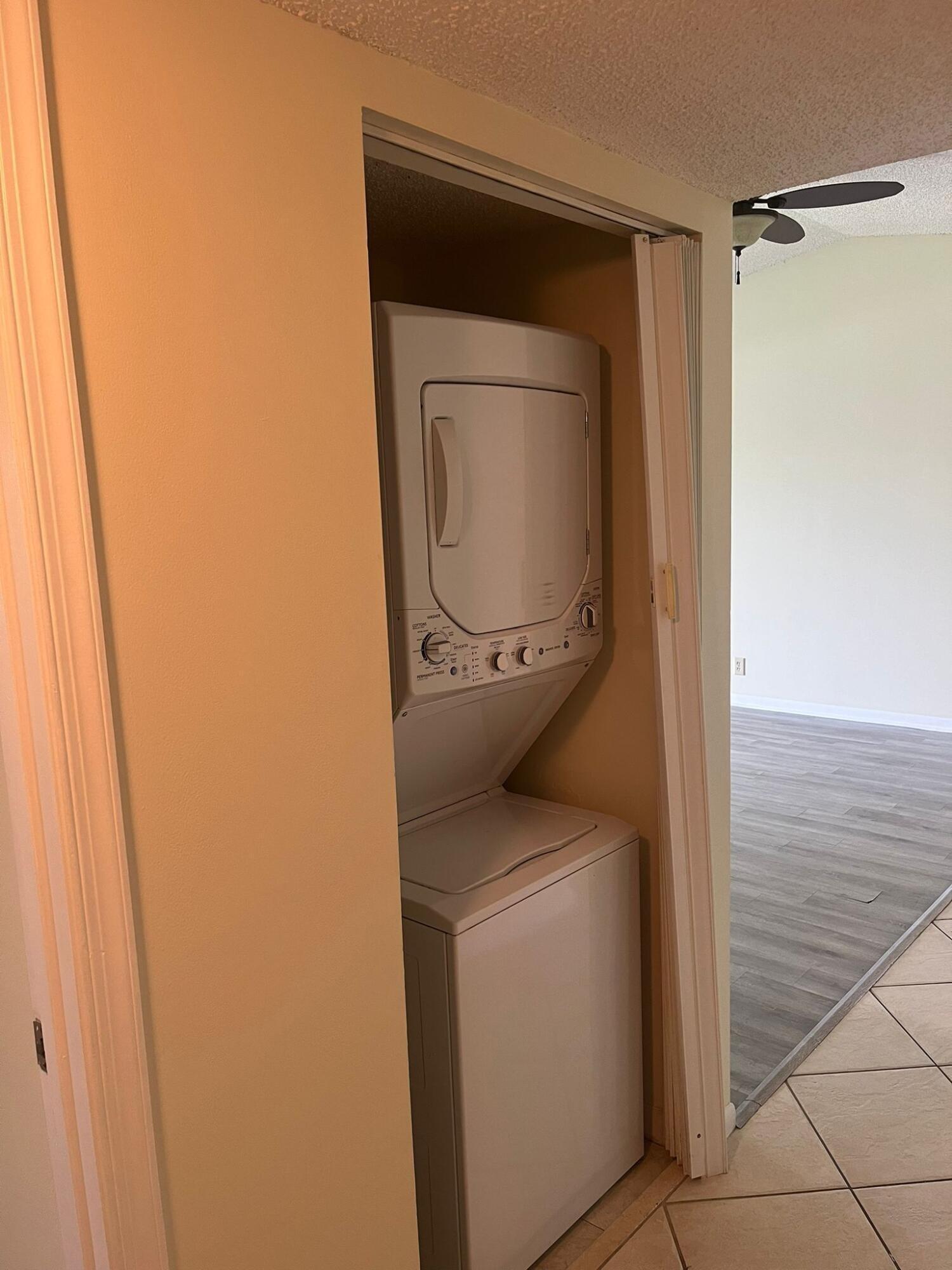 9993 Three Lakes Circle Boca Raton, FL 33428 - Photo 8 of 22 a utility room with dryer and washer