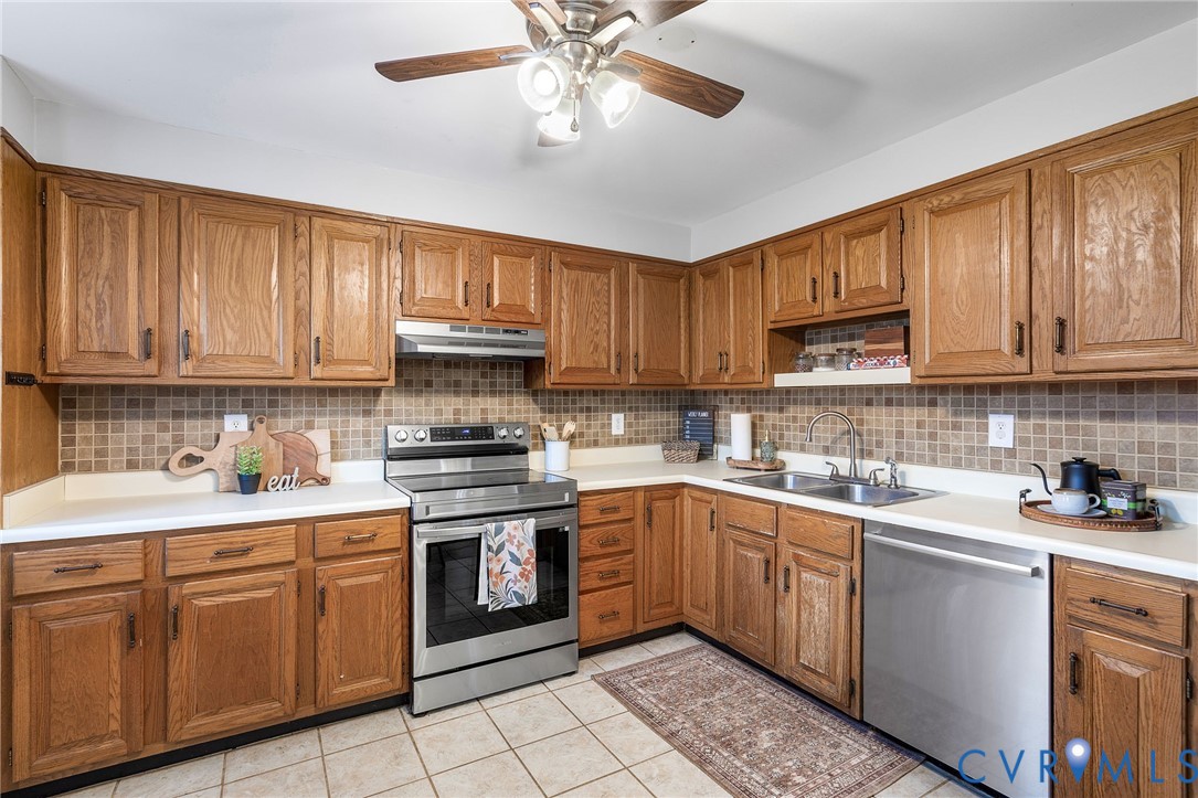6020 Bonneau Road Richmond, VA 23227 - Photo 13 of 36 a kitchen with a sink cabinets and window