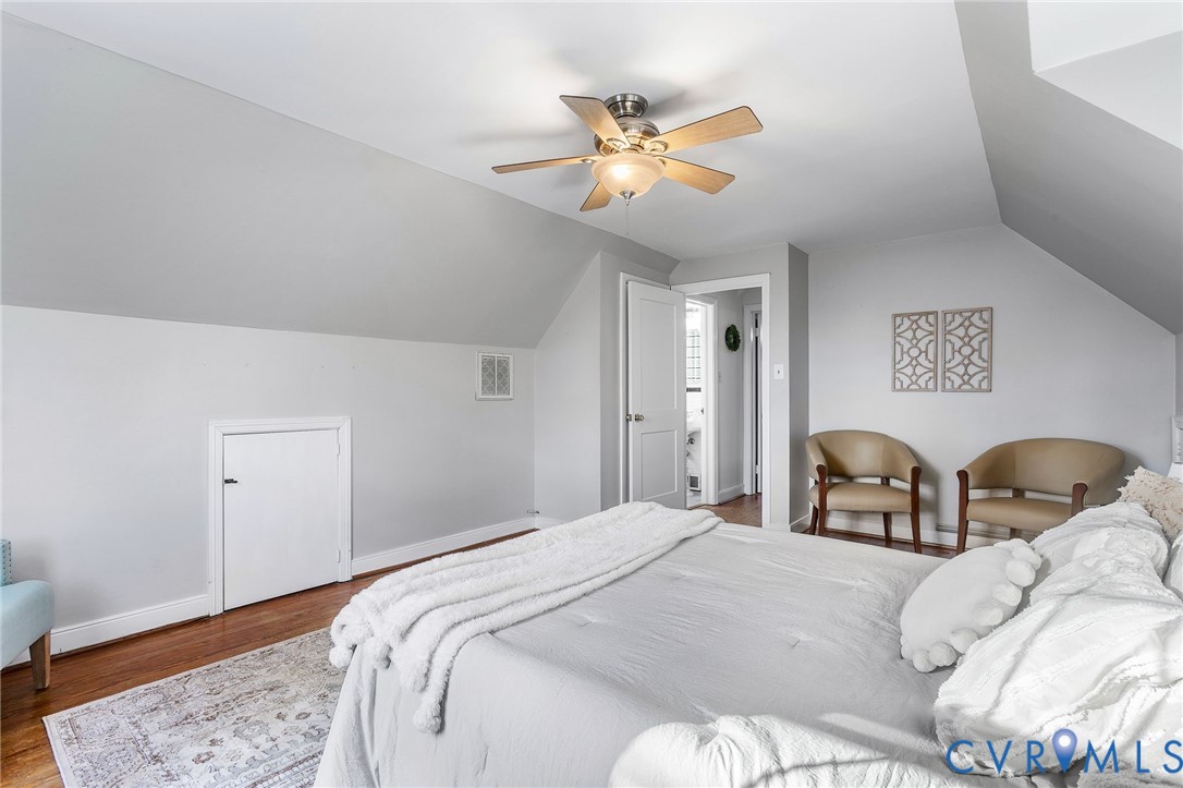 6020 Bonneau Road Richmond, VA 23227 - Photo 21 of 36 a bedroom with a bed and wooden floor
