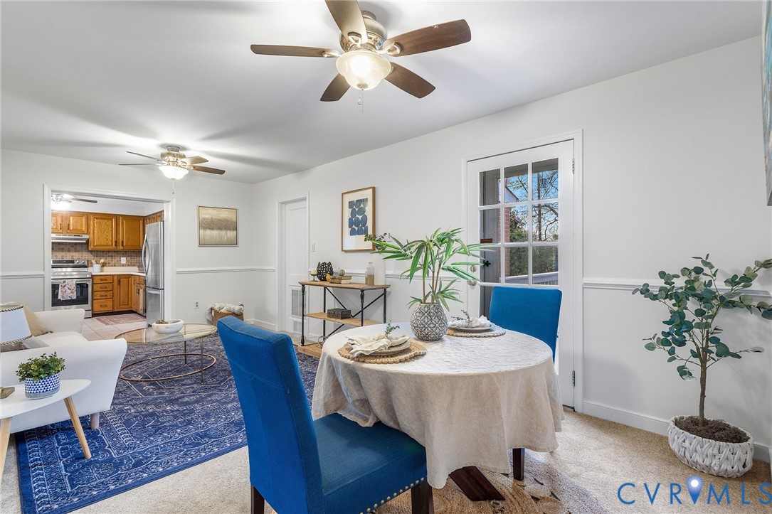 6020 Bonneau Road Richmond, VA 23227 - Photo 10 of 36 a view of a dining room with furniture window and wooden floor