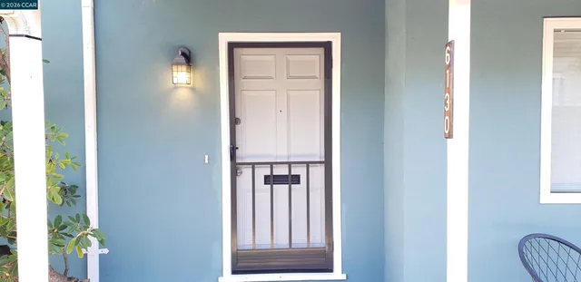 a view of front door with hallway