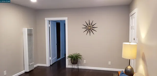 a view of an entryway with wooden floor