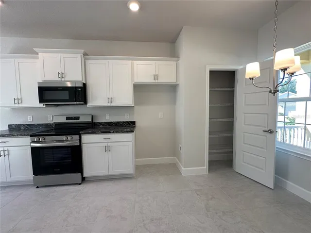 a view of a hallway with staircase