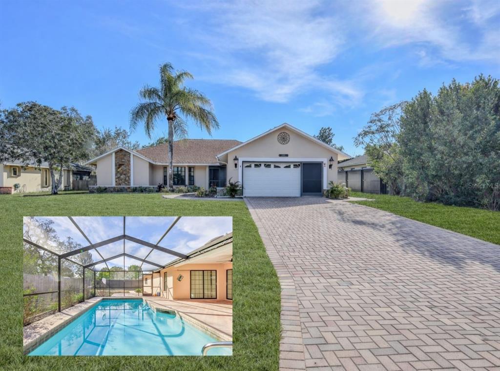 1382 Aladdin Road Spring Hill, FL 34609 - Photo 1 of 45 a view of front of house with a yard