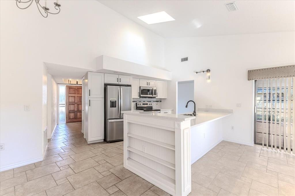 1382 Aladdin Road Spring Hill, FL 34609 - Photo 11 of 45 a view of kitchen with refrigerator and window
