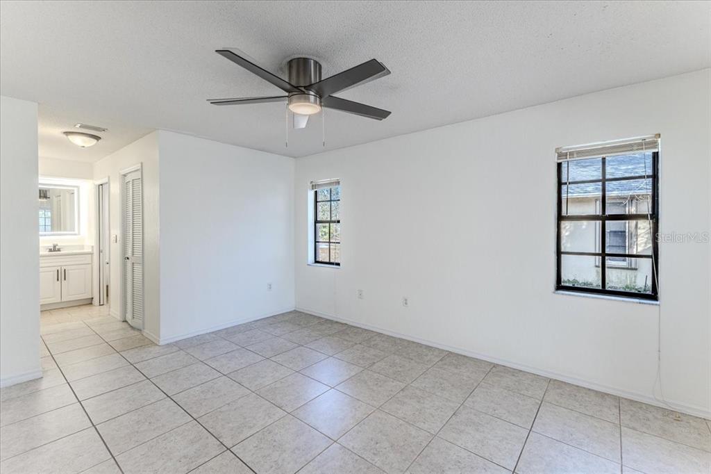 1382 Aladdin Road Spring Hill, FL 34609 - Photo 22 of 45 a view of an empty room with a window