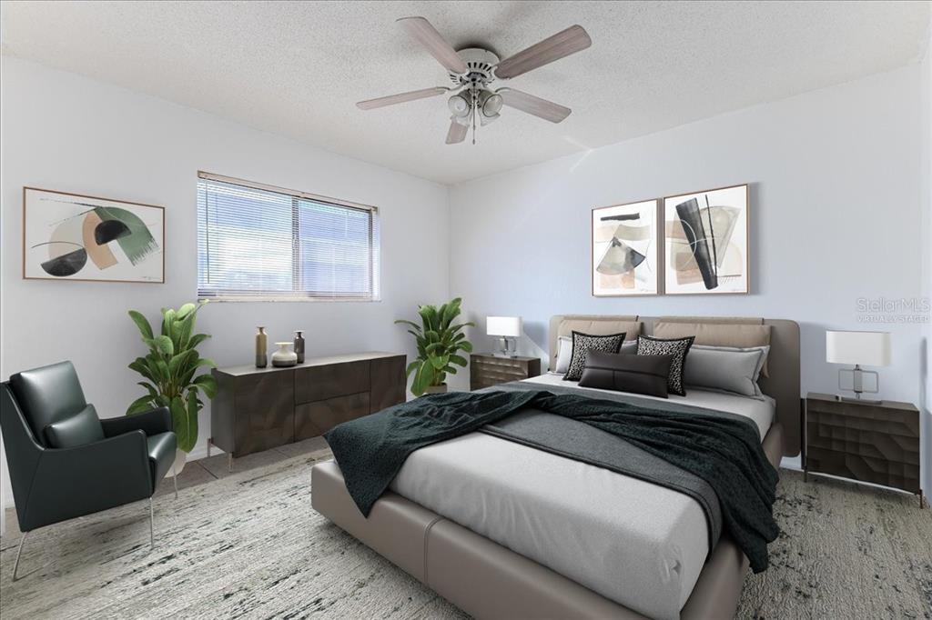 1382 Aladdin Road Spring Hill, FL 34609 - Photo 25 of 45 a bedroom with bed and a couch