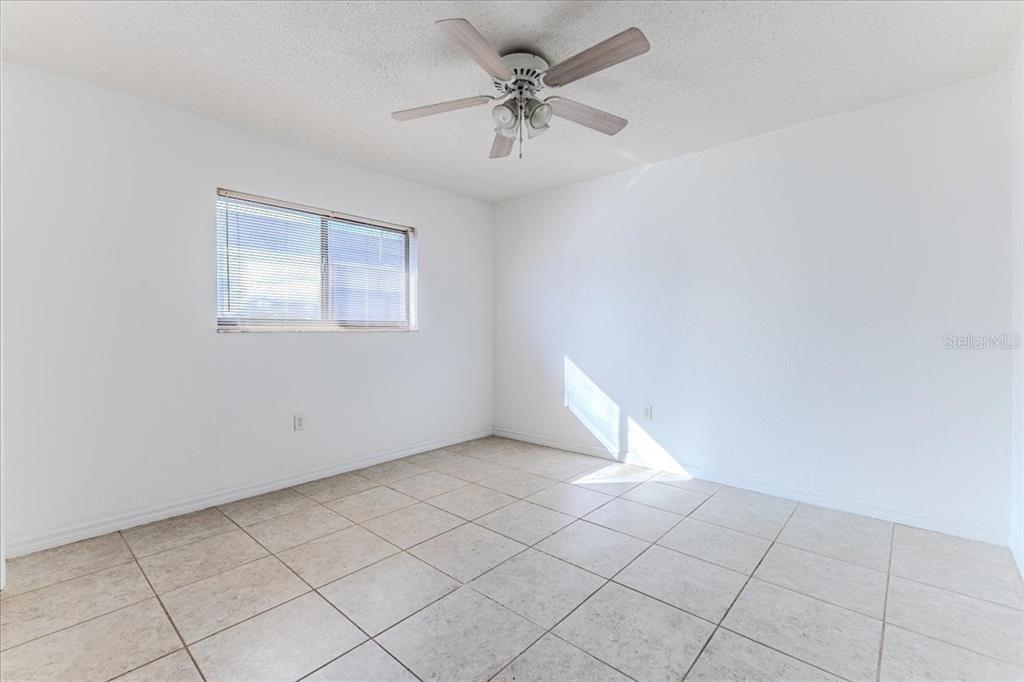 1382 Aladdin Road Spring Hill, FL 34609 - Photo 26 of 45 a view of an empty room with a window