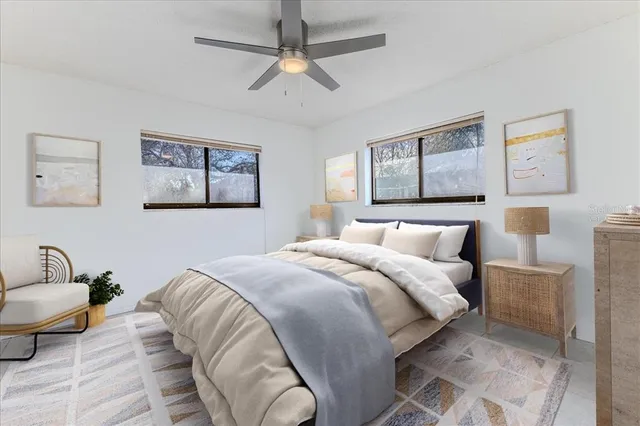 a bedroom with a bed and lamp