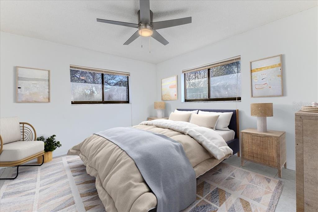 1382 Aladdin Road Spring Hill, FL 34609 - Photo 30 of 45 a bedroom with a bed and lamp