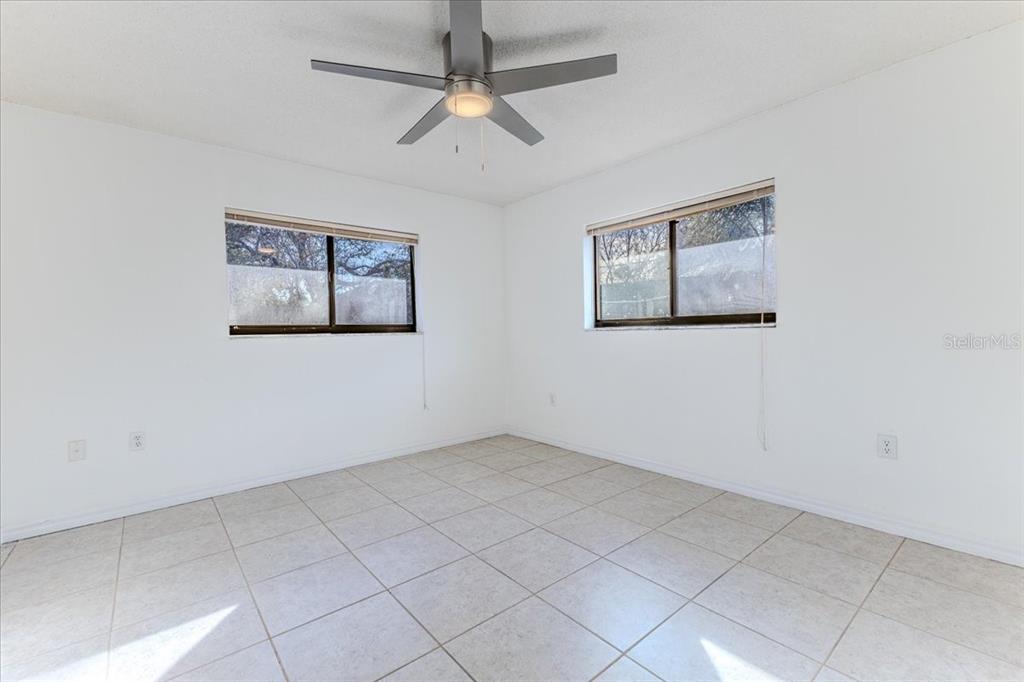 1382 Aladdin Road Spring Hill, FL 34609 - Photo 31 of 45 a view of an empty room with a window