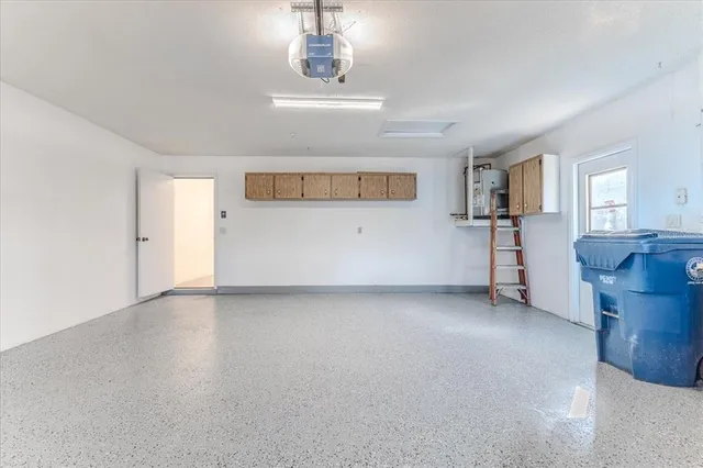 a view of a room with a sink and a refrigerator