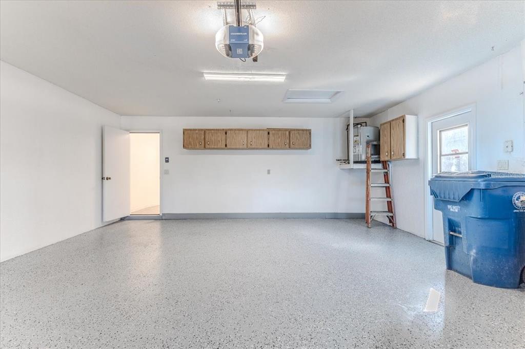 1382 Aladdin Road Spring Hill, FL 34609 - Photo 35 of 45 a view of a room with a sink and a refrigerator