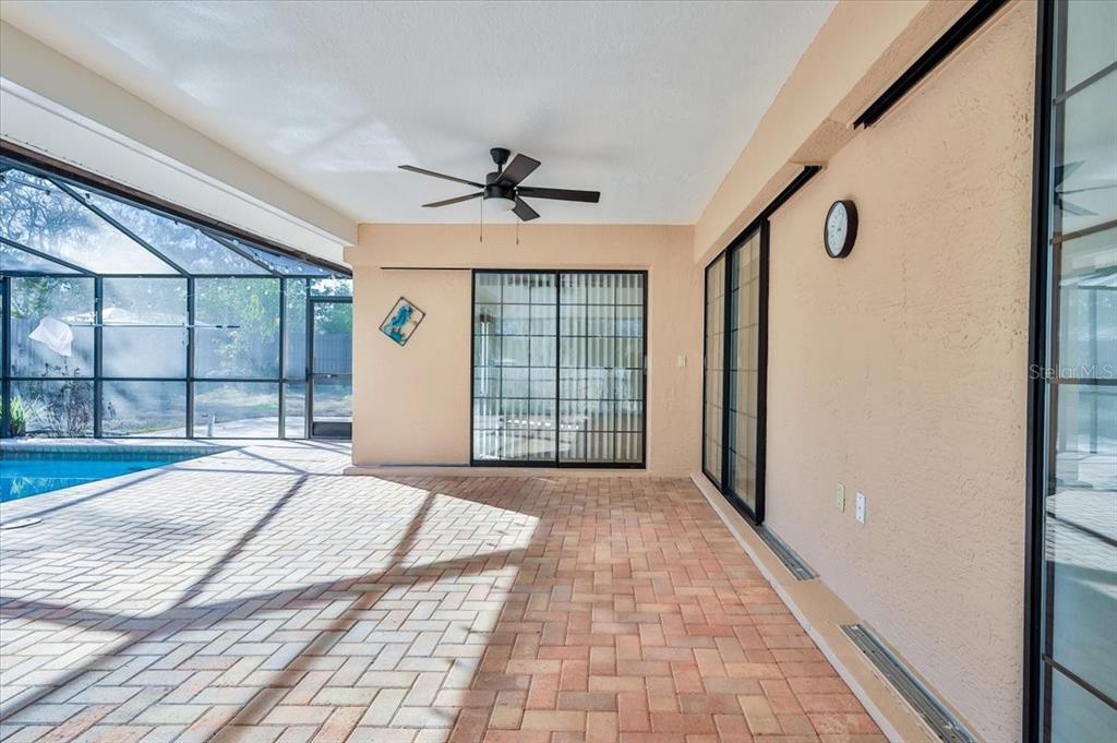1382 Aladdin Road Spring Hill, FL 34609 - Photo 38 of 45 a view of a livingroom with a ceiling fan and window